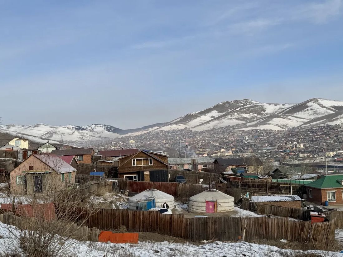Ger-district housing on the snow-covered hills above a Mongolian city